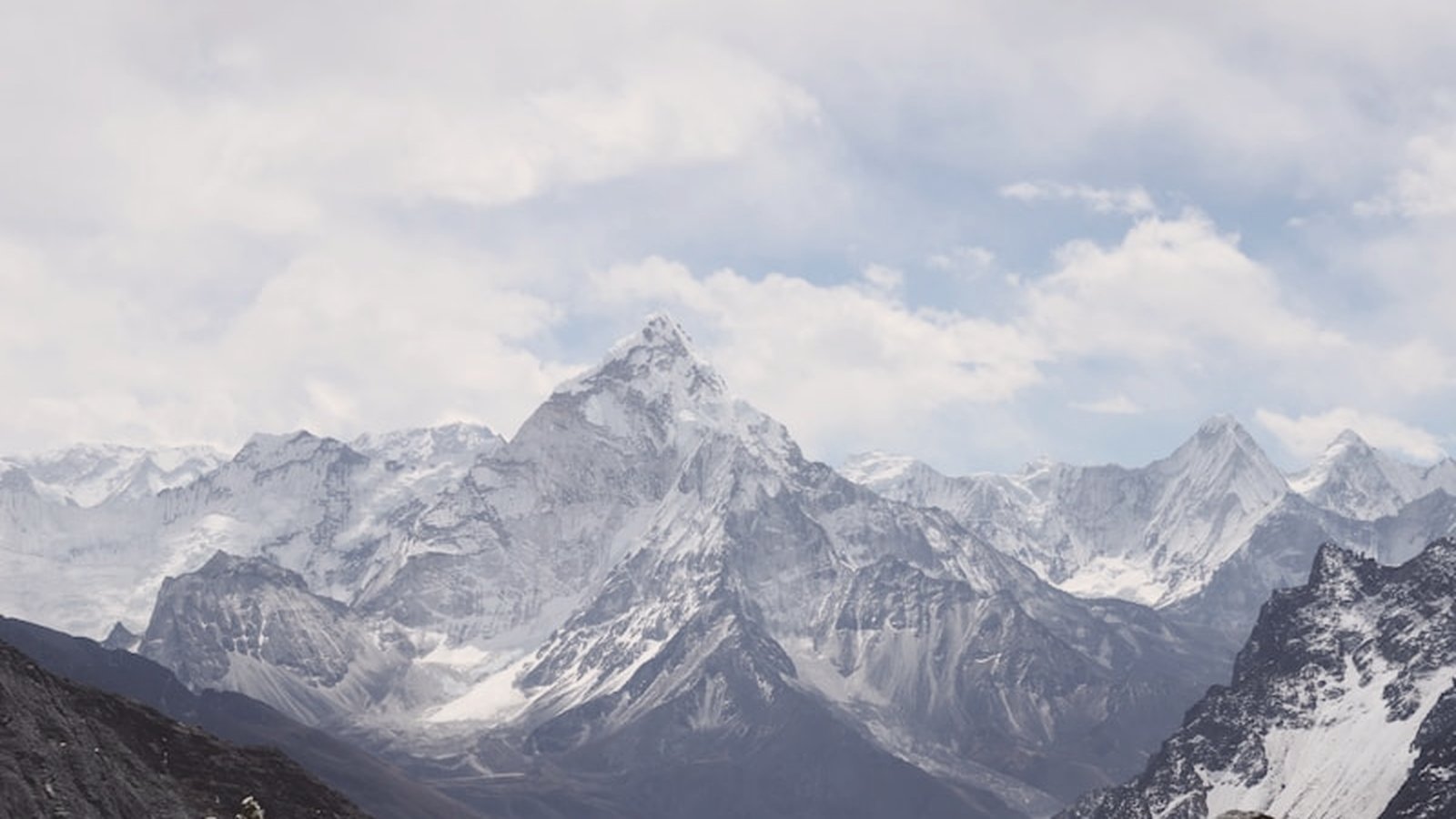 Remote snow-capped mountain terrain, isolated hard country